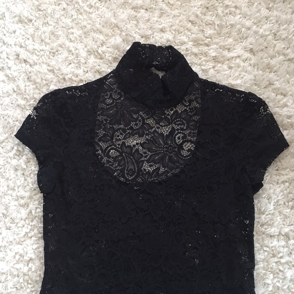 Sheer lace turtleneck shirt with cutout back